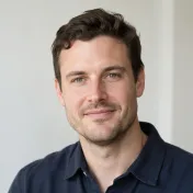 Portrait of a smiling man in a dark jacket